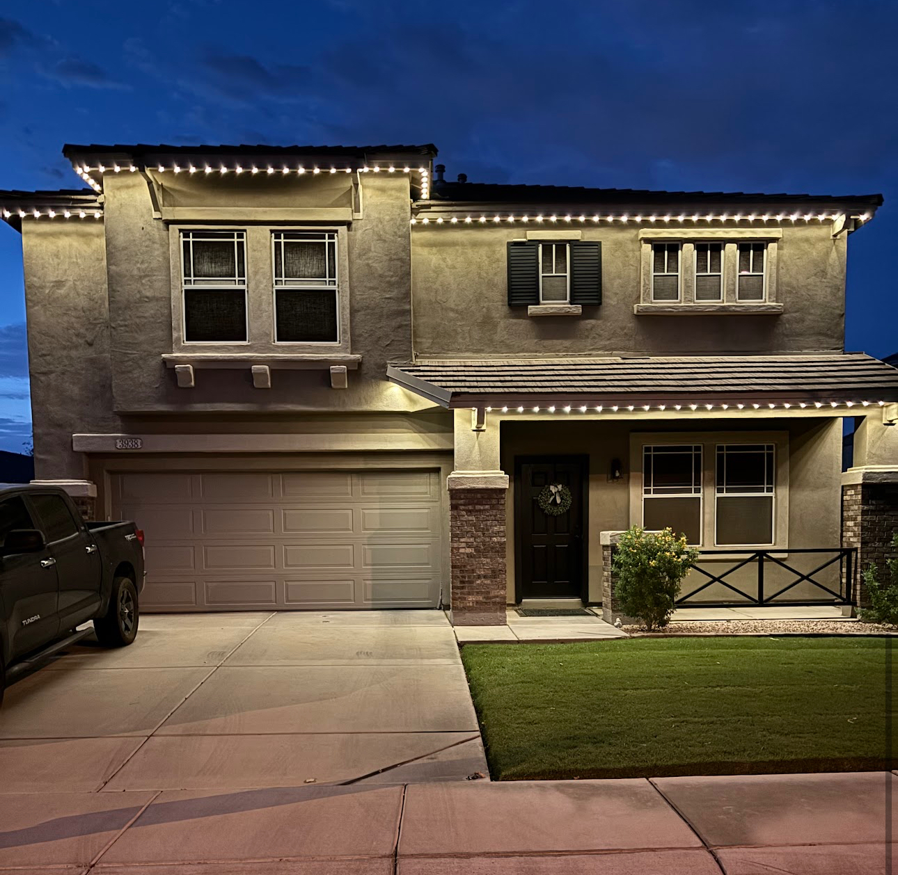 Phoenix home Halloween orange LED roofline lighting display