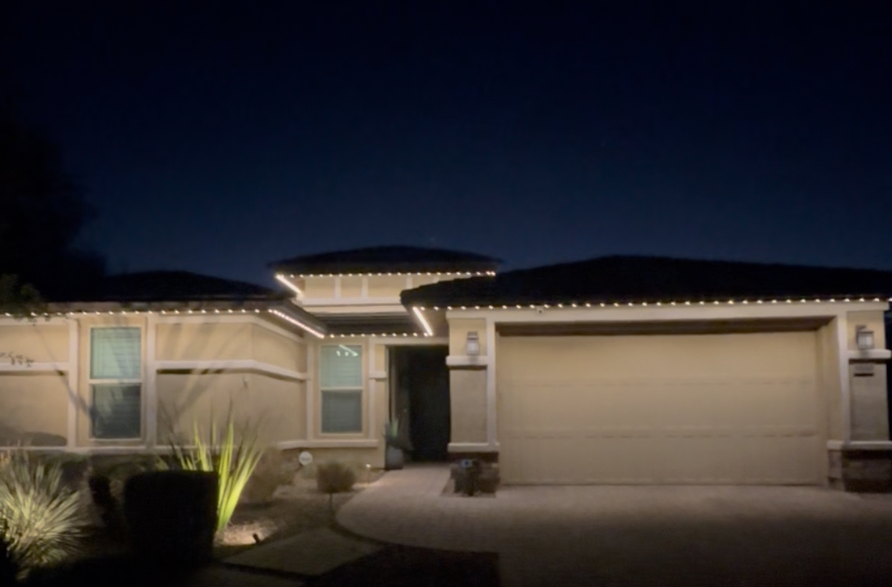 Scottsdale home permanent LED roofline lighting illuminated at night with app-controlled colors